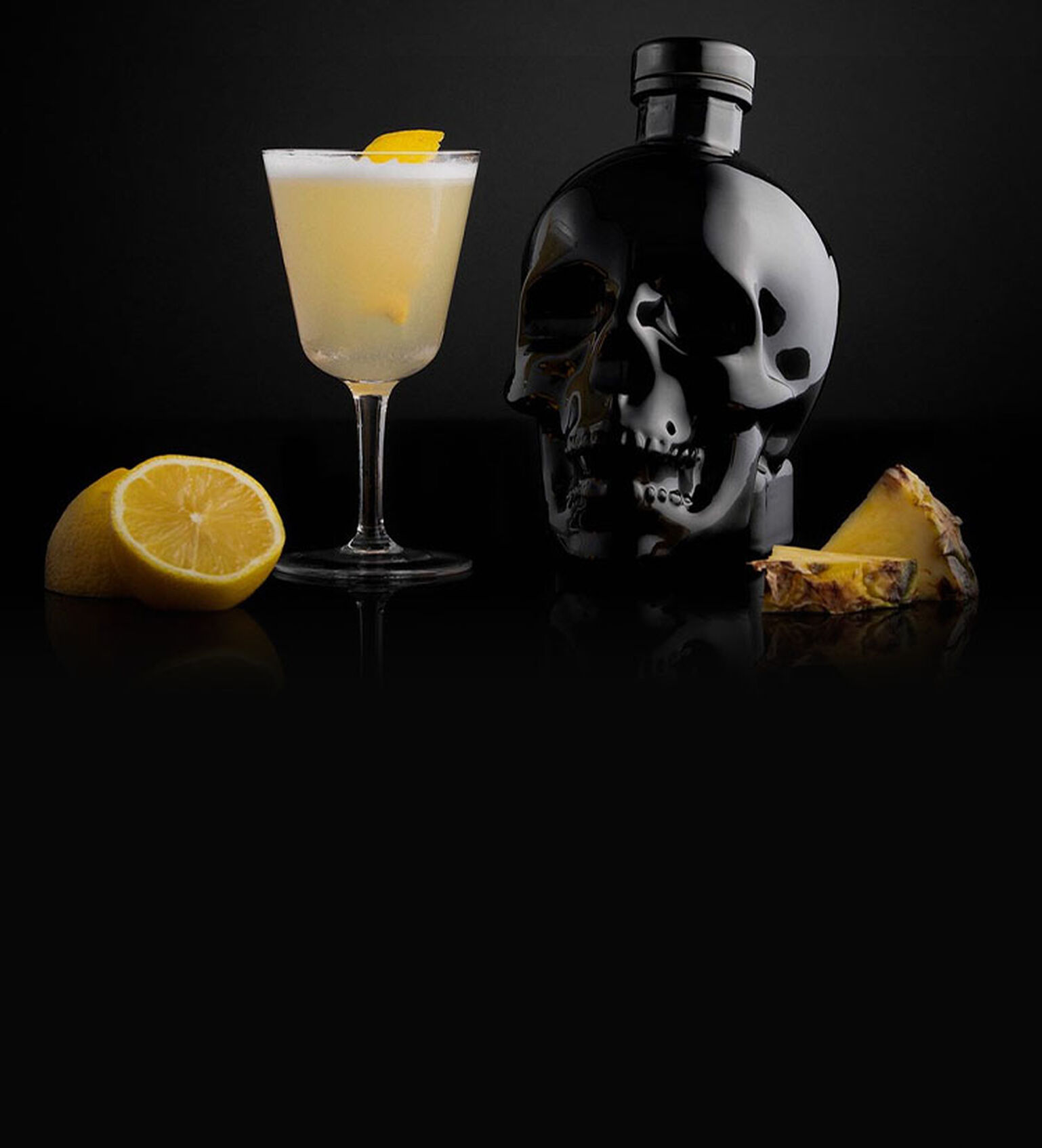 Image of a Crystal Head Onyx Vodka cocktail on a black mirrored surface